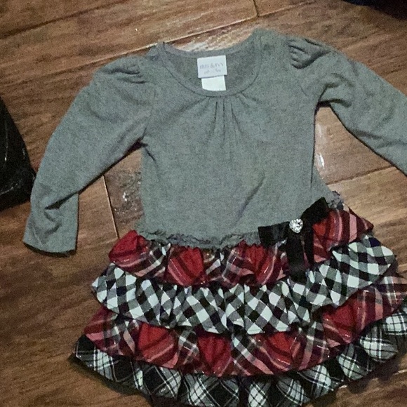 it’s a checker dress with red white and gray - Picture 1 of 2